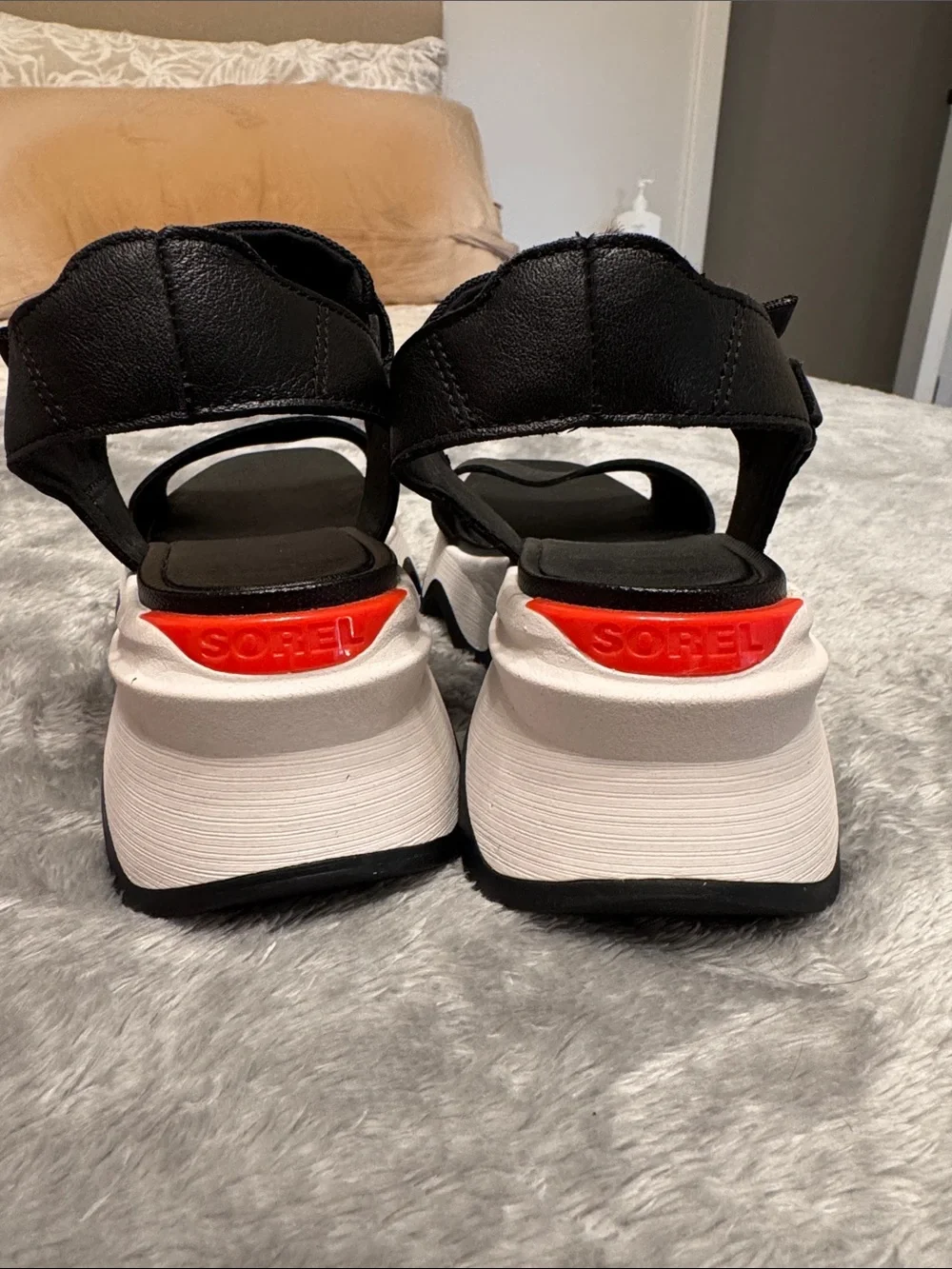Sorel Black Platform Sandals with White Sole and Red Accent
